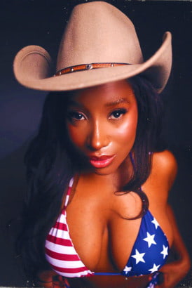 Busty black girl in a cowboy hat and stars and stripes bikini